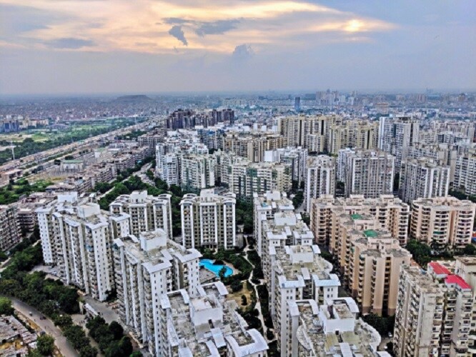 Noida extension_a city with tall buildings and tall buildings